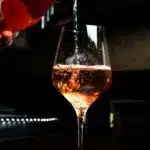 Enjoying a nice glass of bubbly, liquor pours in wine glass