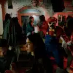 , people in red and blue mask