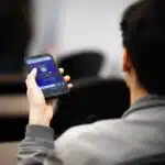 , a person holding a cell phone